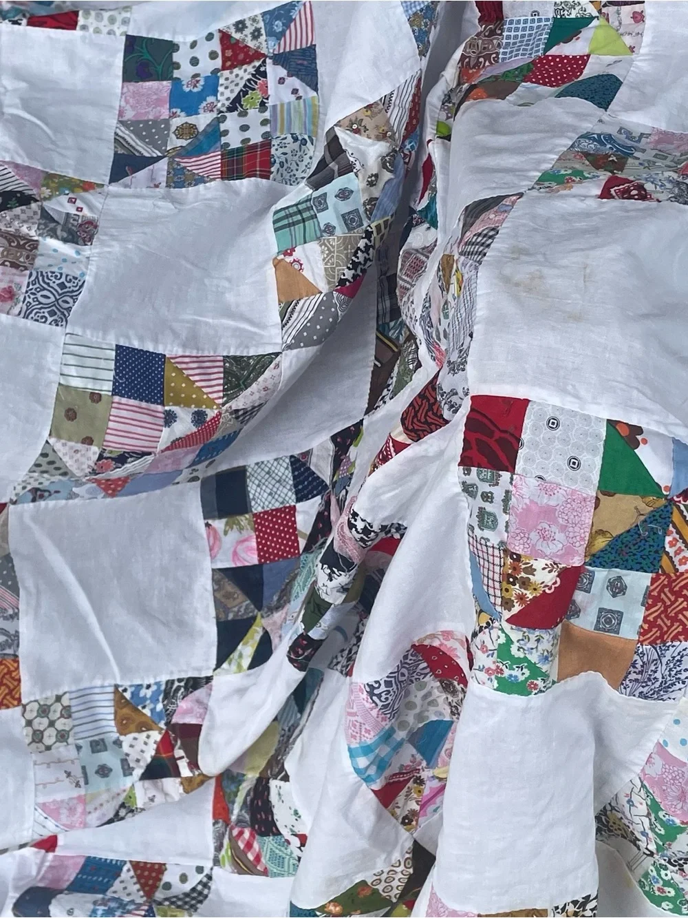 Handmade Hand stitched  White Patchwork Quilt with Multicolored Squares.